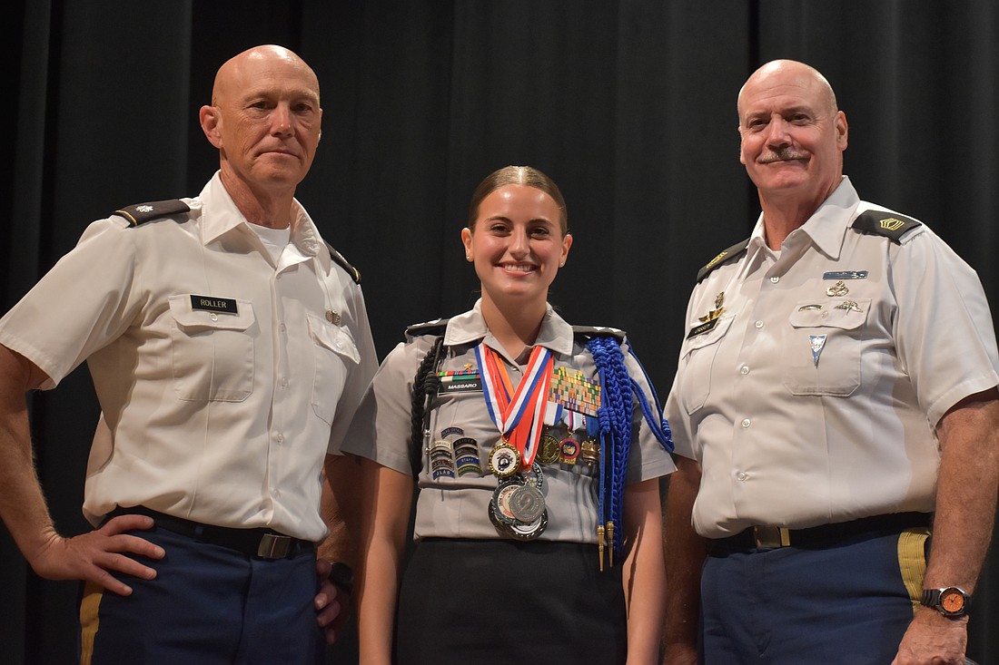 Elisa Massaro, a senior and battalion commander of the Lakewood Ranch High School Junior Reserve Officers' Training Corps, is glad to have had the support of her teachers Richard Roller and William Cassidy.