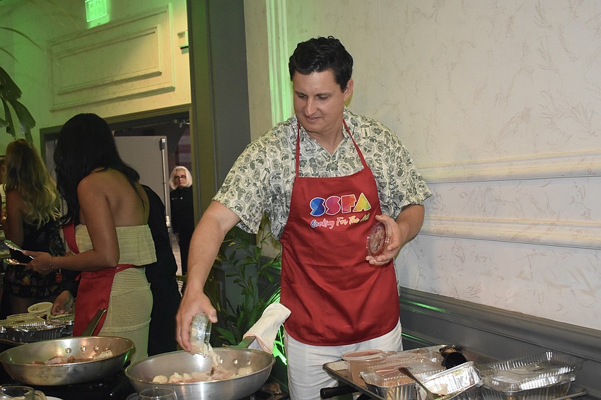 Corey LaDow adds some ingredients.