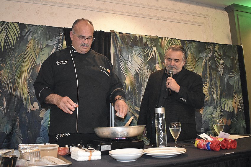 Chefs Jamil Pineda and Phil Mancini lead the room in cooking dinner.