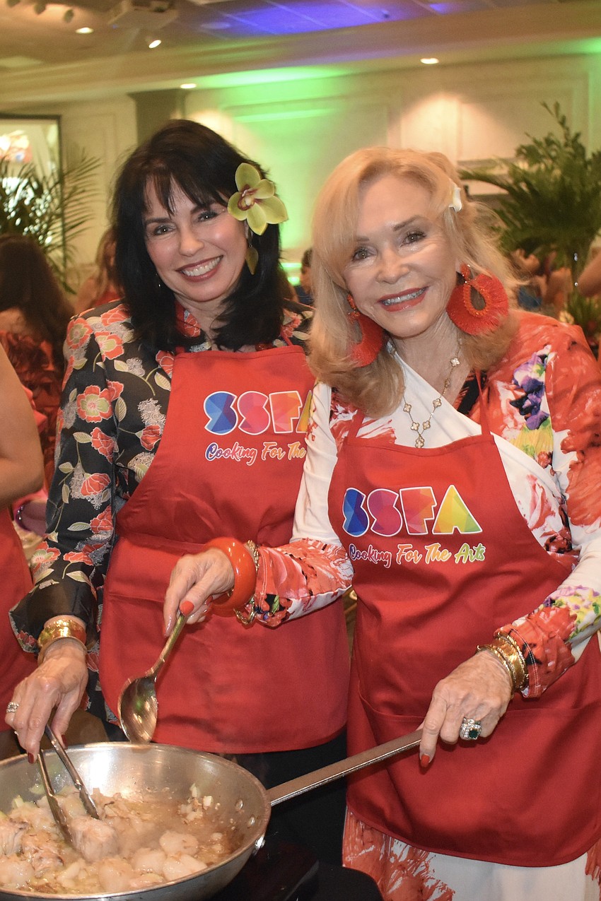 Nikki Sedacca and Margaret Wise cook some seafood.