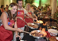 Molly Biter, Winfred Van Workum and Katie Moulton get the meal sizzling.
