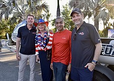 River Strand's Bonnie and Manoj Mathew stand between two of the crew members. John Pallasch is on the left and Joe Leach is on the right.