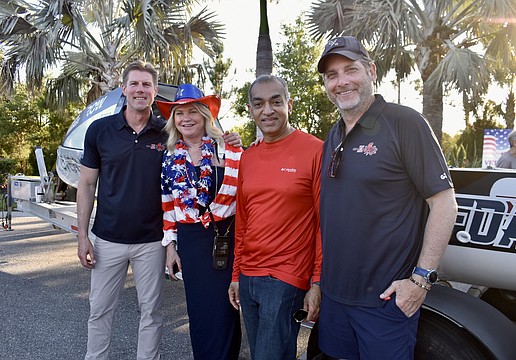 River Strand's Bonnie and Manoj Mathew stand between two of the crew members. John Pallasch is on the left and Joe Leach is on the right.