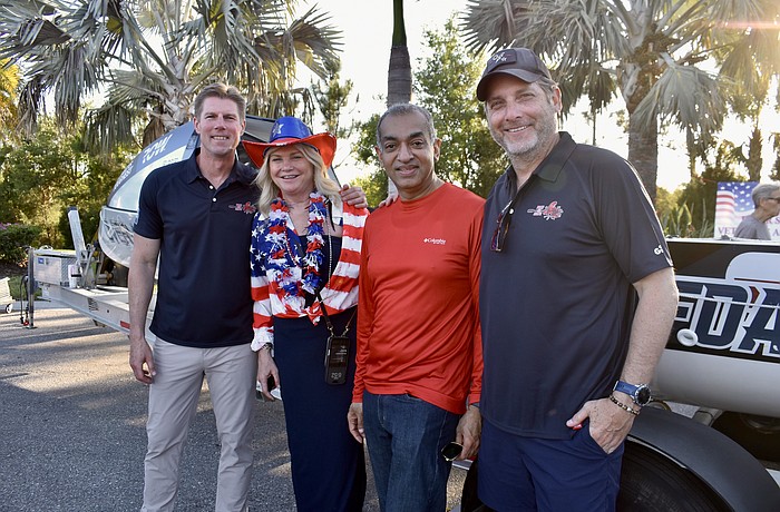 River Strand's Bonnie and Manoj Mathew stand between two of the crew members. John Pallasch is on the left and Joe Leach is on the right.
