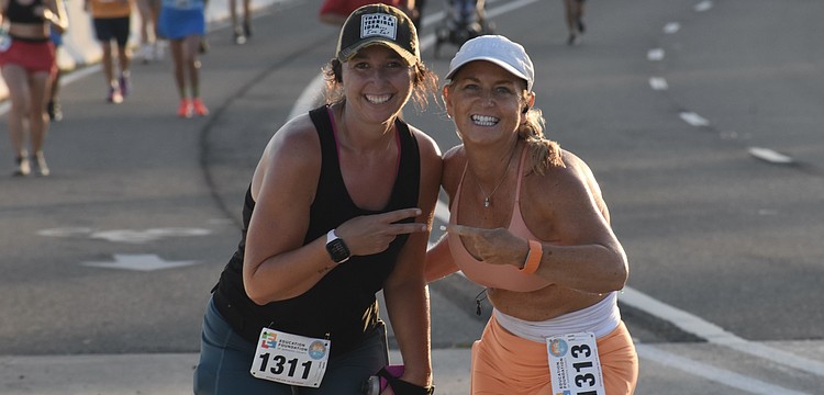 Rebecca Resinski and Amy Stevens show their support.