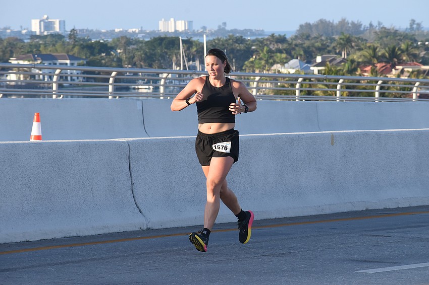 Trisha Lampi heads across the Ringling Bridge.