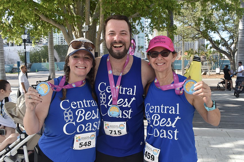 Laura Ansel, Hunter Carpenter and Kim Livengood celebrate finishing the race.