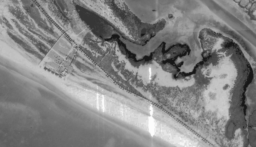 The north end of Longboat Key as pictured in 1940 show what is now Gulf of Mexico Drive lined on each side with Australian pine trees, a landscaping project spearheaded by John Ringling in his early efforts to develop the island.