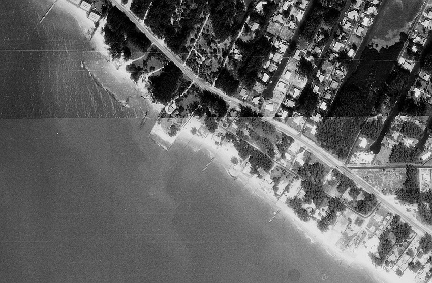 In 1973, many man-made structures including the Ohana seawall can be seen as residents battled erosion.