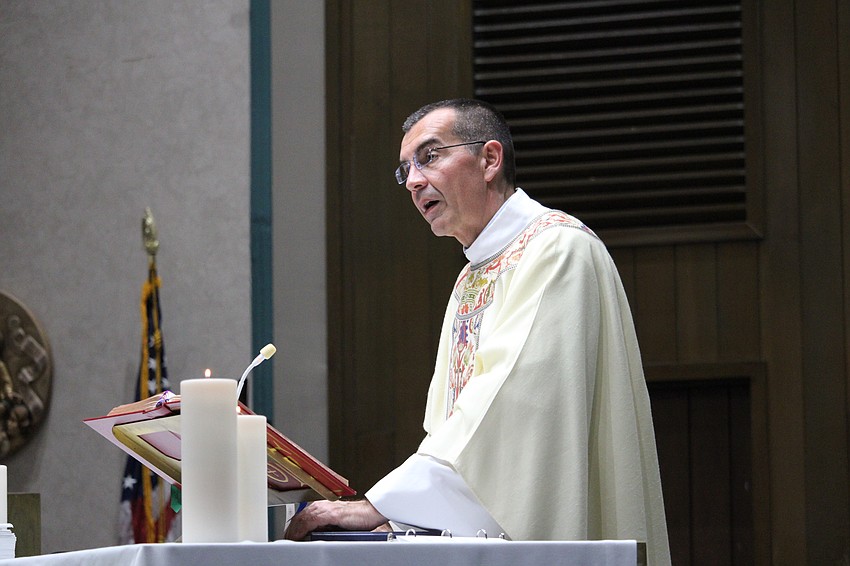 Father Robert Dziediak welcomes everyone to the April 14 installation mass for the new leadership of the Women's Guild of St. Mary, Star of the Sea, Catholic Church.