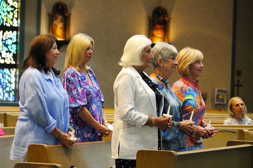 Outgoing board members Lyn Kennelly, Kay Kochenderfer, Marilyn Davol, Mary del Pup and Susan Gilmore Clarke listen to words of commendation for their work.
