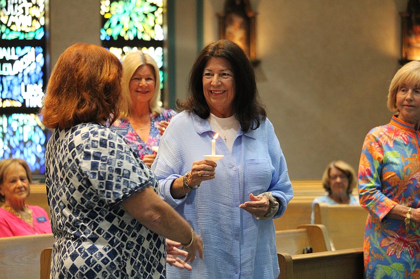 Vice President Lyn Kennelly passes the torch to Mary McGinn.