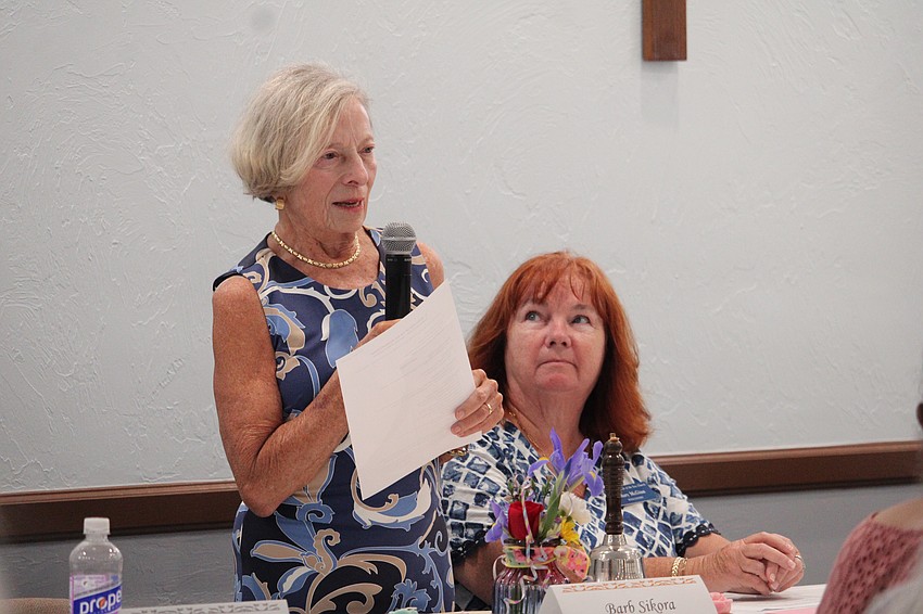 Barb Sikora delivers her first remarks as the new president of the Women's Guild, starting by thanking Kay Kochenderfer for her excellent leadership.