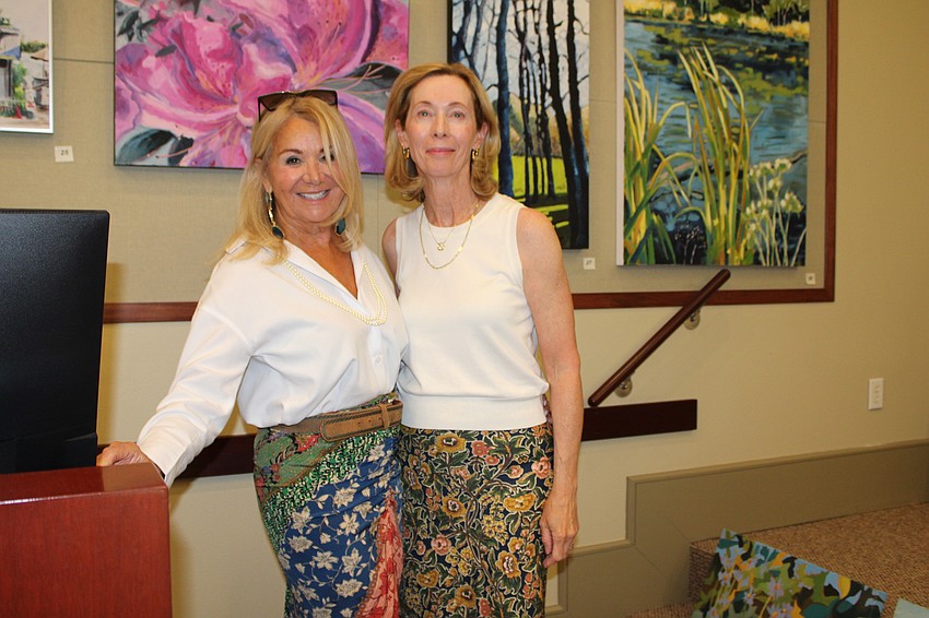 Artist Marie Therese Lacroix connects with Mayor Debra Williams at the reception.