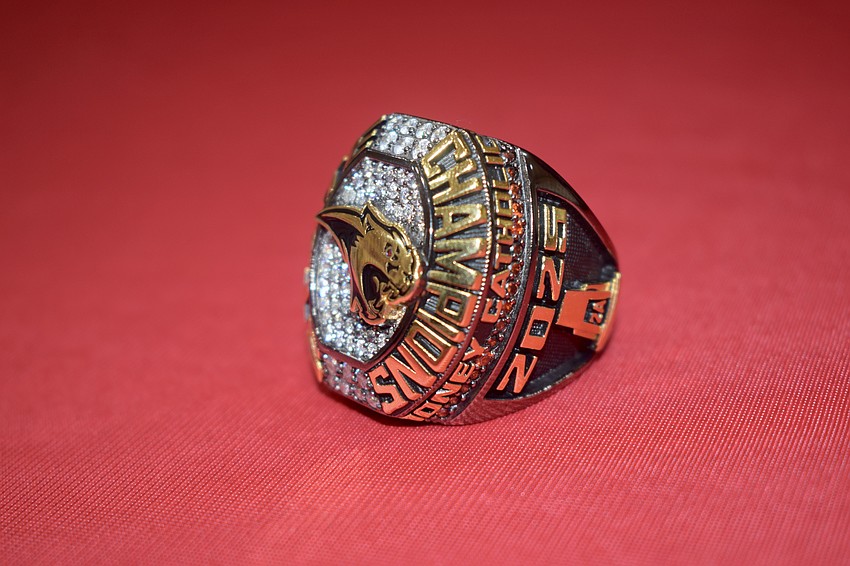 The Cougars' 2025 state championship ring features more than diamonds. On the inside, for example, every playoff opponent and outcome is listed to commemorate the team's title run.