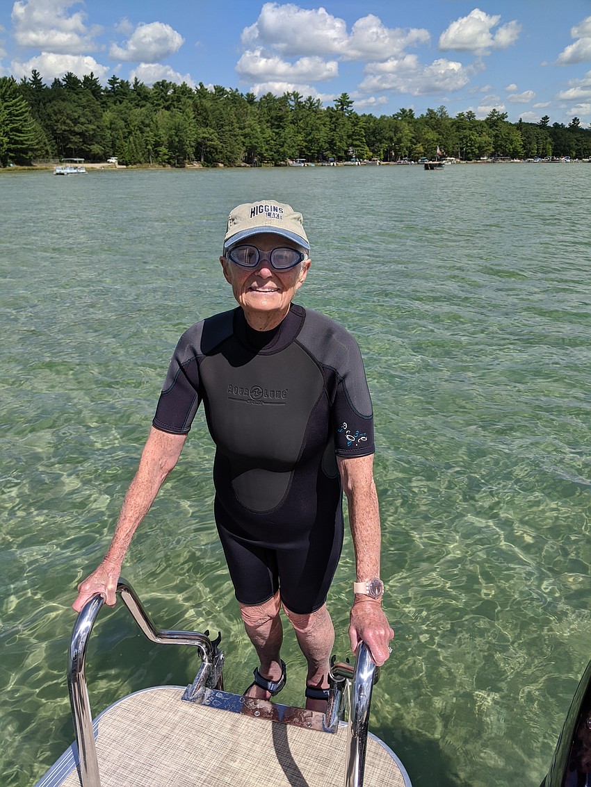 Jean Craig Flynn enters the waters of Higgins Lake.