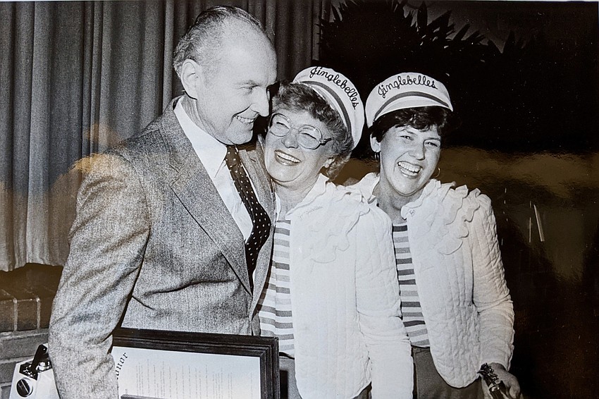 Singing telegram recipient Charles Sheridan stands with Jean Craig Flynn and Pat Moore.