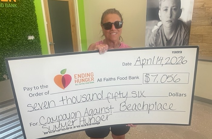 Volunteer Linda Gass helped organize a Beachplace fundraiser for All Faiths Food Bank, which included a golf tournament and tabletop games.