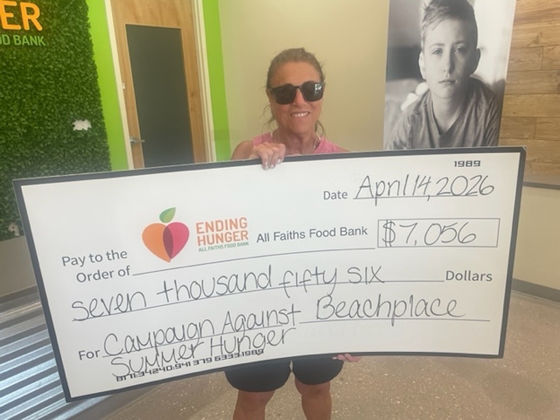 Volunteer Linda Gass helped organize a Beachplace fundraiser for All Faiths Food Bank, which included a golf tournament and tabletop games.