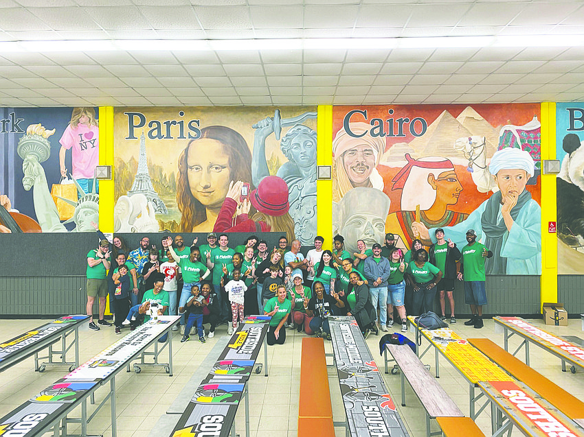Fidelity Investments associates in Jacksonville volunteer once or twice a year for “Transformation Day” at Southside Middle School to paint, renovate restrooms, tend to the school’s community garden and perform other improvement projects.