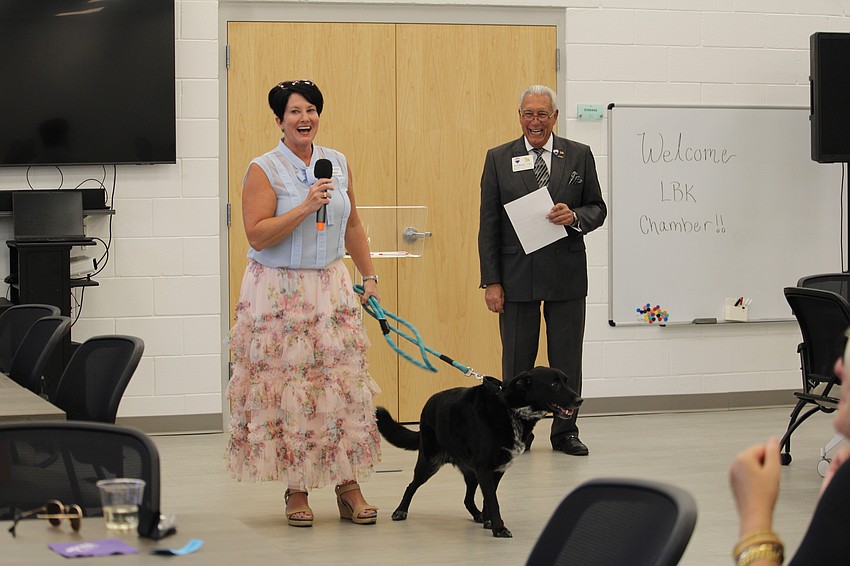 At the Longboat Key Chamber of Commerce's April 29 Off the Clock meetup, Humane Society of Sarasota County Executive Director Connie Boros introduces members to her newly adopted dog, Poncho. Chamber member Andrew Vac welcomed guests before they toured the facilities.