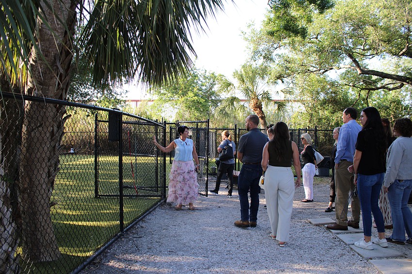 Humane Society of Sarasota County Executive Director Connie Boros leads a tour of the outdoor facilities at the Sarasota headquarters.