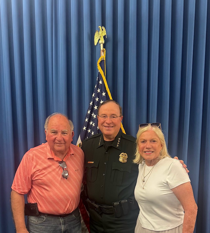 Dean and Janet Mixon meet with Polk County Sheriff Grady Judd April 24 after Polk Sheriff Charities, Inc. bought the Mixons' food truck, the Mixon Swirl.