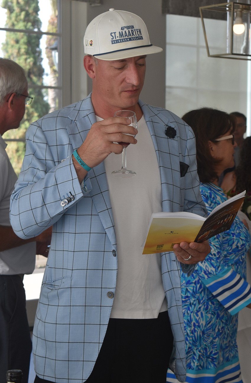 After smelling and tasting the various wines from Damilano Winery, Lake Club's Travis Vaniter says he is sure to go home with a bottle or two.