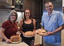 The Sourdough Society of Lakewood Ranch members Camille Piccininni, Erica Calka and David Wiegand each created a loaf of sourdough with different ingredients to make each unique.