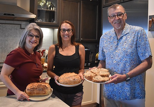 The Sourdough Society of Lakewood Ranch members Camille Piccininni, Erica Calka and David Wiegand each created a loaf of sourdough with different ingredients to make each unique.