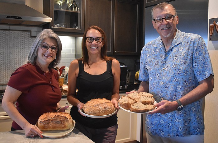 The Sourdough Society of Lakewood Ranch members Camille Piccininni, Erica Calka and David Wiegand each created a loaf of sourdough with different ingredients to make each unique.