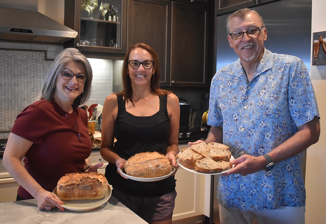 The Sourdough Society of Lakewood Ranch members Camille Piccininni, Erica Calka and David Wiegand each created a loaf of sourdough with different ingredients to make each unique.