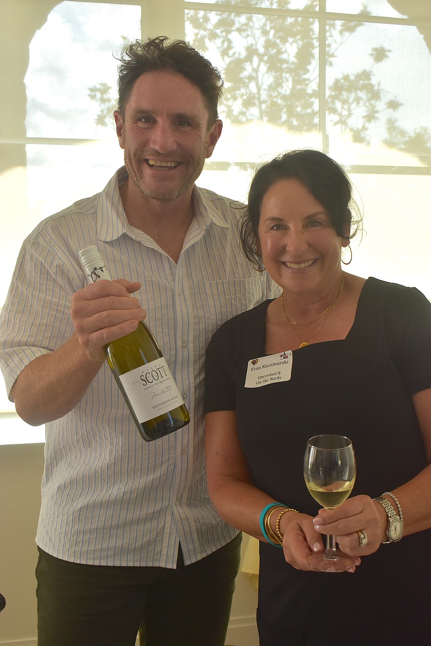 Josh Scott of Allan Scott Family Winemakers is glad to serve Americans, including Fran Kuczmarski who lived in New Zealand for a couple of years, because they are friendly and eager to try the wines.