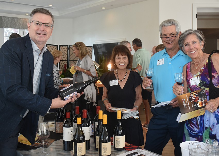 Winery Ambassador Keith Ross of Alto Moncayo Garnacha serves wine to Lu-Anne Albert, Bob Chalson and Barbara Chalson.