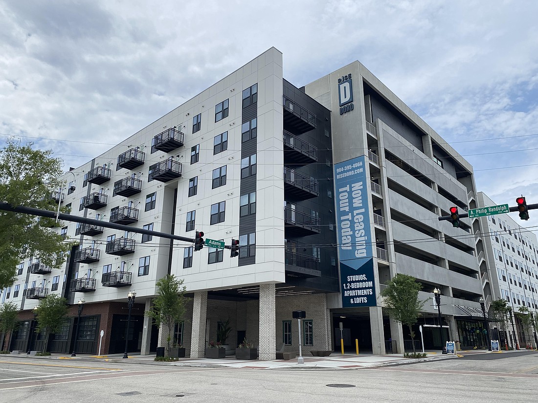 On May 1, Rise: A Real Estate Co. distributed invitations to a June 4 private opening for its Rise Doro apartments at 960 E. Adams St. The project is nearing completion after being destroyed by fire in January 2024.