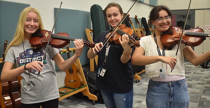 Caroline Bartlomiejczuk, Sage Alcorn and Sofia Ortega are members of the orchestra at Lakewood Ranch High School.