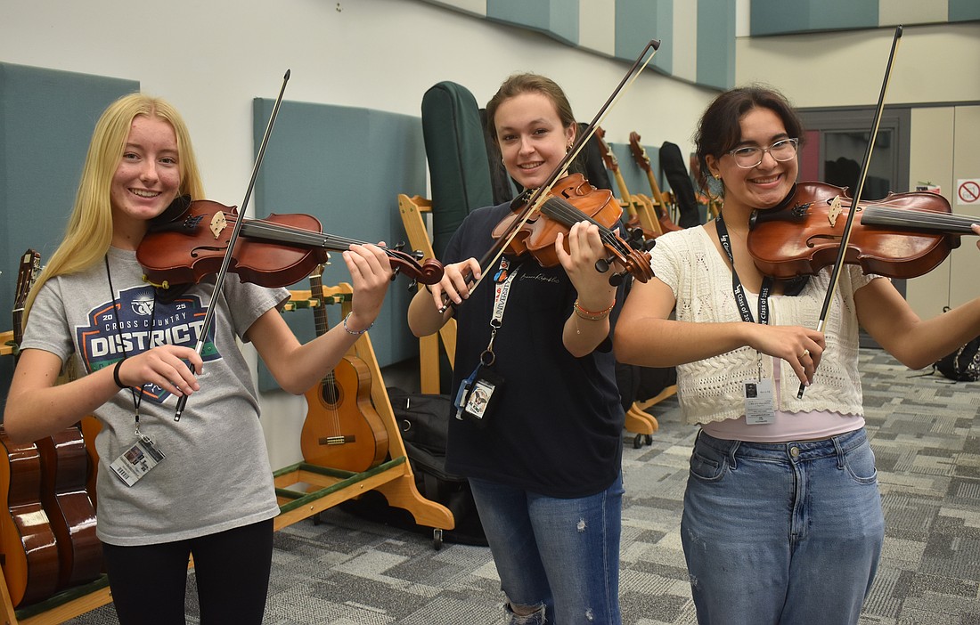 Caroline Bartlomiejczuk, Sage Alcorn and Sofia Ortega are members of the orchestra at Lakewood Ranch High School.