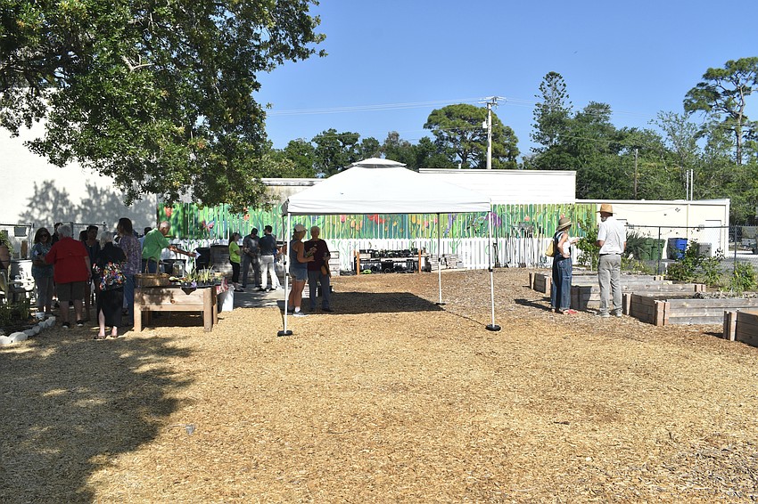 Attendees visit the garden.