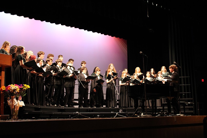 Jack Christie, a senior at Lakewood Ranch High School, conducts the choir as co-president at the spring concert April 28.