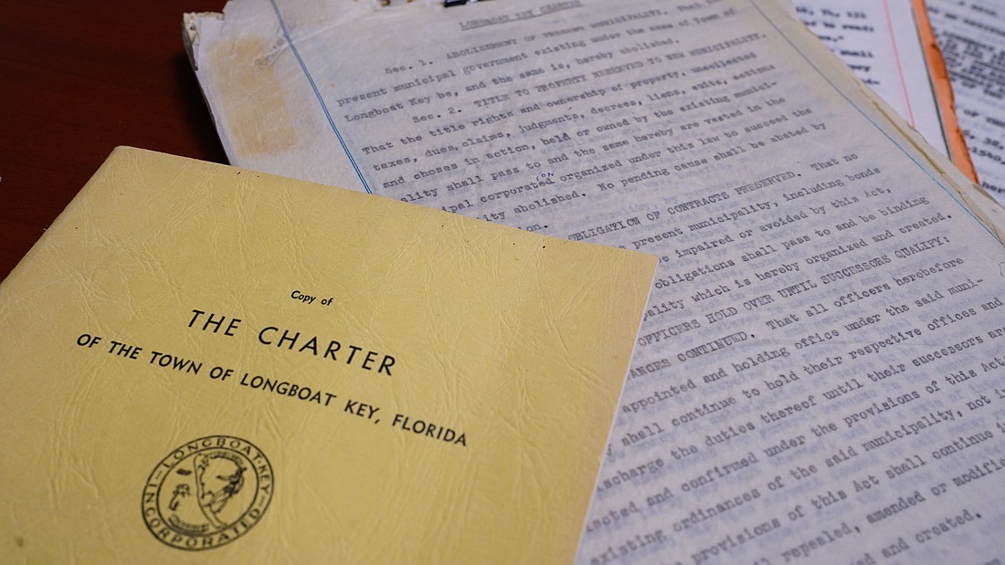 The original 1957 Longboat Key Town Charter is printed on rice paper and stored at Town Hall, along with copies of the original document printed in 1959.