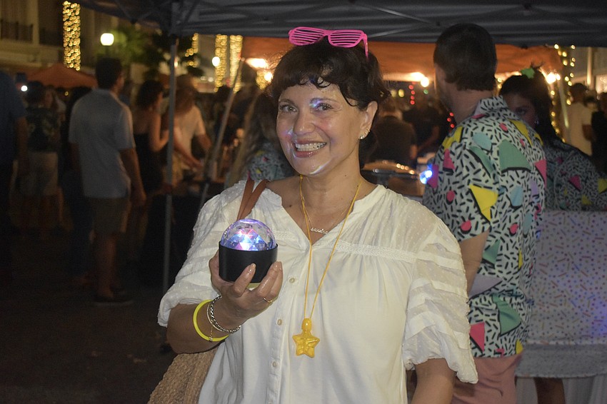 Sandra Alexander casts some color about.