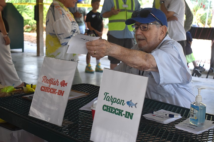 Lakewood Ranch's Larry Naddeo of the Lakewood Ranch Anglers Club checks in children for the Youth & Teen Fishing Seminar May 2.
