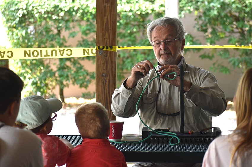 Carl Blazejewski, who has been a member of the Lakewood Ranch Anglers Club for 3 years, demonstrates how to tie a knot.