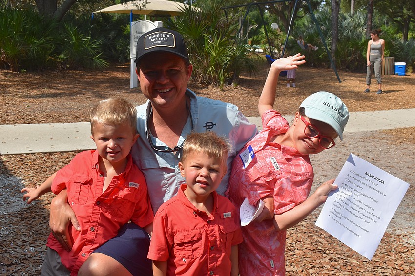 Lakewood Ranch's Zack Barnett is ready to lend a hand to his children Wiley, Weller and Nolie at the Youth & Teen Fishing Seminar at Summerfield Park May 2.