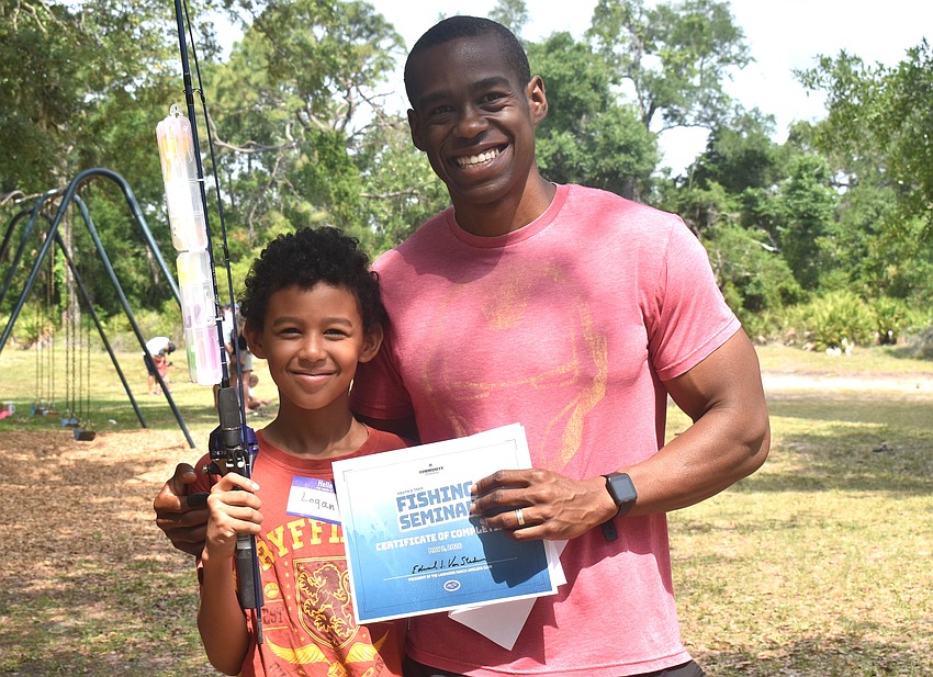 Lakewood Ranch's Logan Jones, 9, has fished only once before the Youth & Teen Fishing Seminar. His dad James Jones was there to share the joy of completing the seminar.