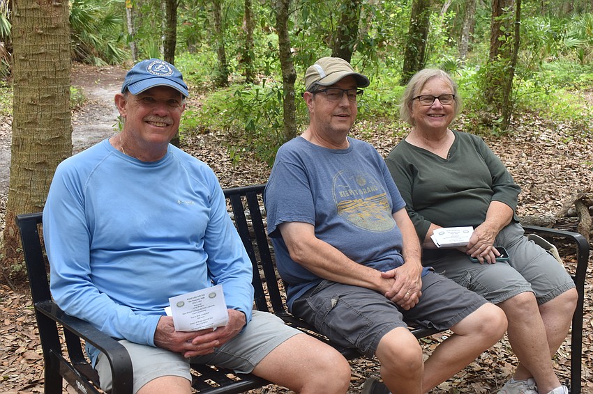 Don Bouchard, Tim Jarosik and Nancy Jarosik gather before the World Labyrinth Day program on the Peaceful Path May 2.