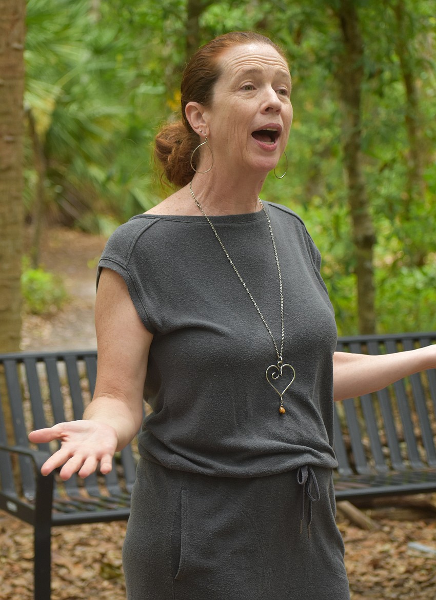 Eirinn Camphire, the ministry coordinator for Peace Presbyterian Church, tells those in attendance the history of World Labyrinth Day.