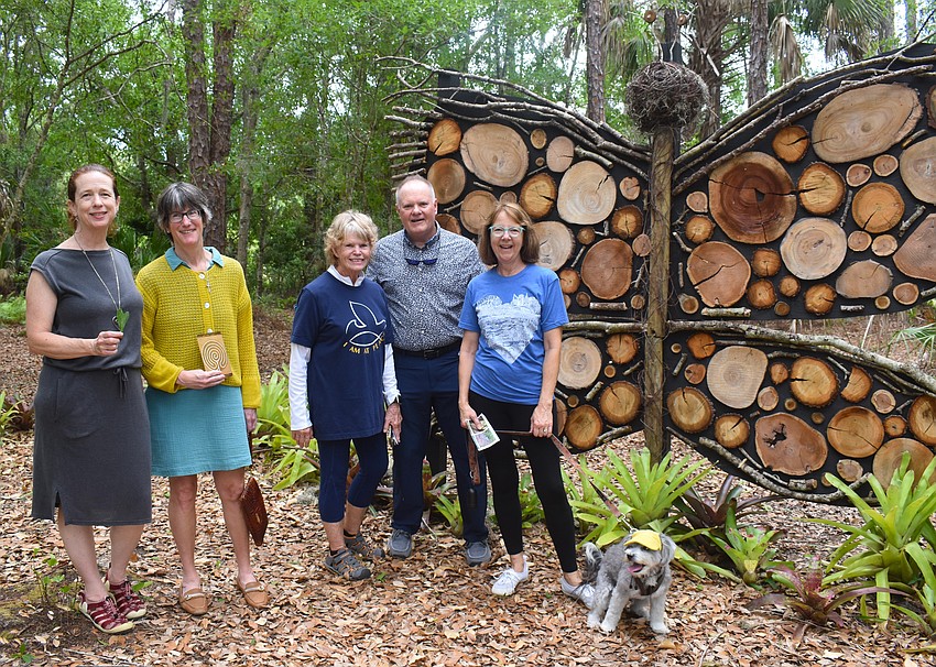 Eirinn Camphire, Tina Juillerat, Jamie Reagan, Chris Snow and Debbie Snow explore the Peaceful Path after the World Labyrinth Day program May 2.
