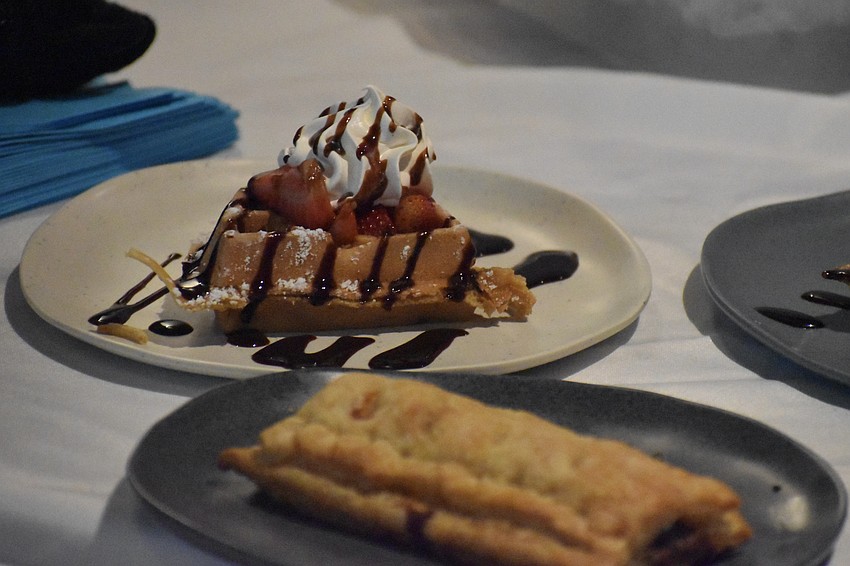 Waffles from Waffle Monkey are on sale at a table.