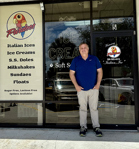 The Purple Donkey owner, Daniel Cope, in front of the new location for The Purple Donkey opening on May 22. Photo by Alexis Miller